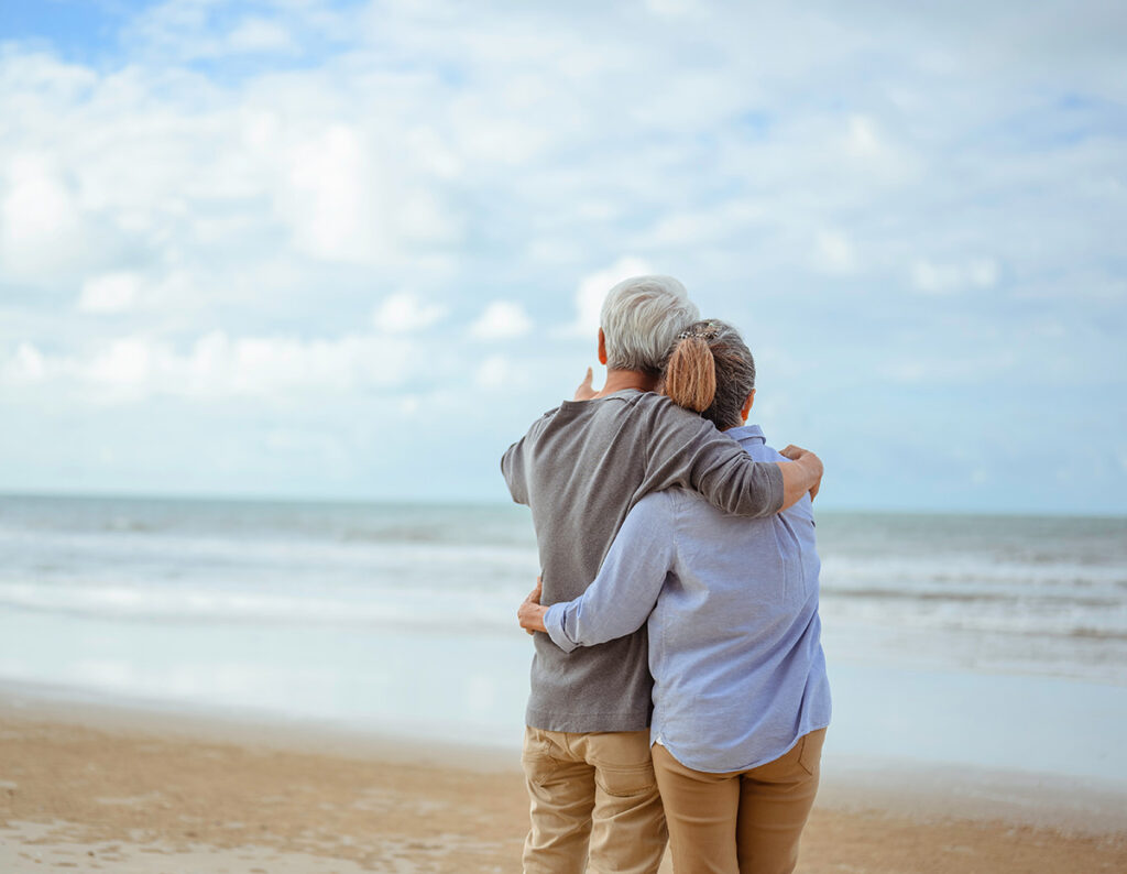 mature couple enjoying retirement on the beach